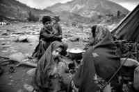 30 year old Anayat and her children. Tent # 284 in spontanious camp Bela Noorshah by the Neelum river in Muzzafarabad