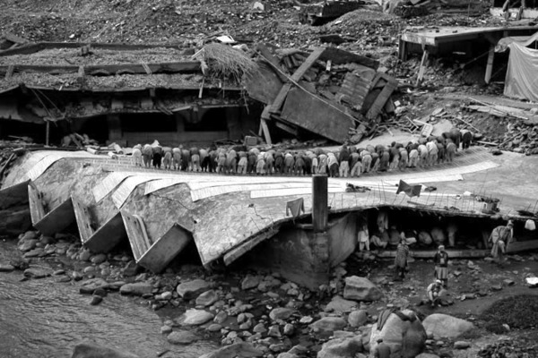 Afternoon prayer on the roof of a collapsed mosque in Balakot : Short Stories : Charlotte Oestervang Photography