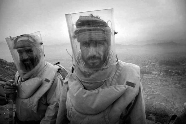 Deminer Imam Gul and Said Rahman from Danish Demining Group are lining up and getting ready to start their work on TV Hill in Kabul : Demining in Kabul : Charlotte Oestervang Photography